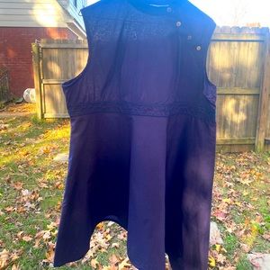 Handmade navy tunic with angled hem.